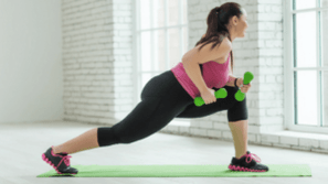 The girl is a exercise with dumbbells