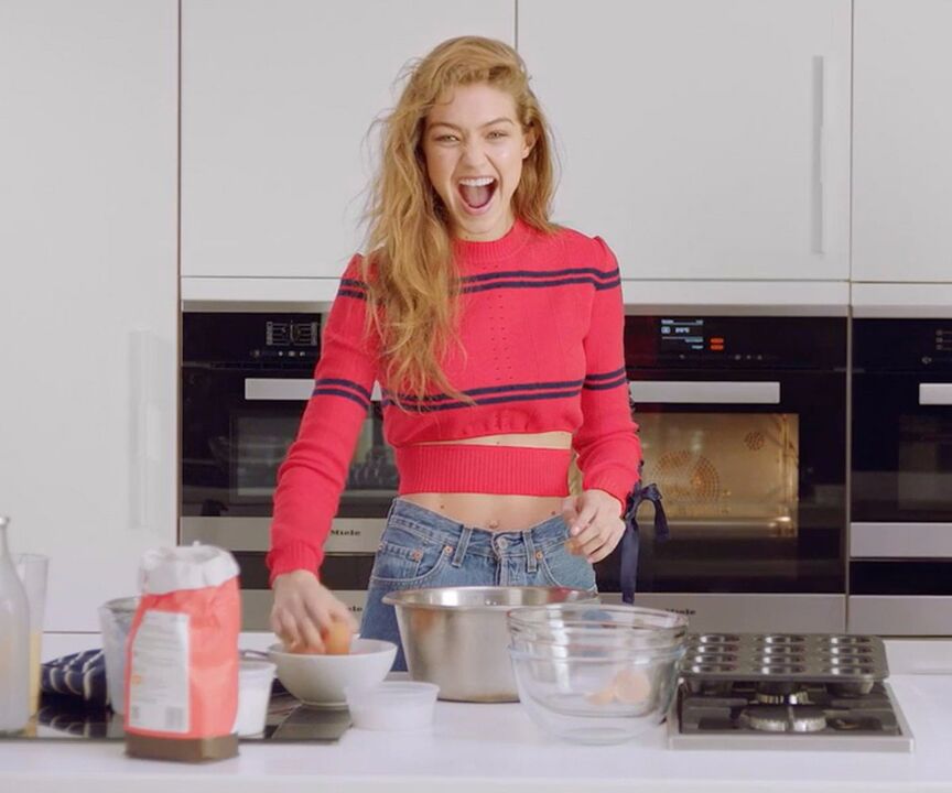 Elegant girl prepares herself a healthy breakfast